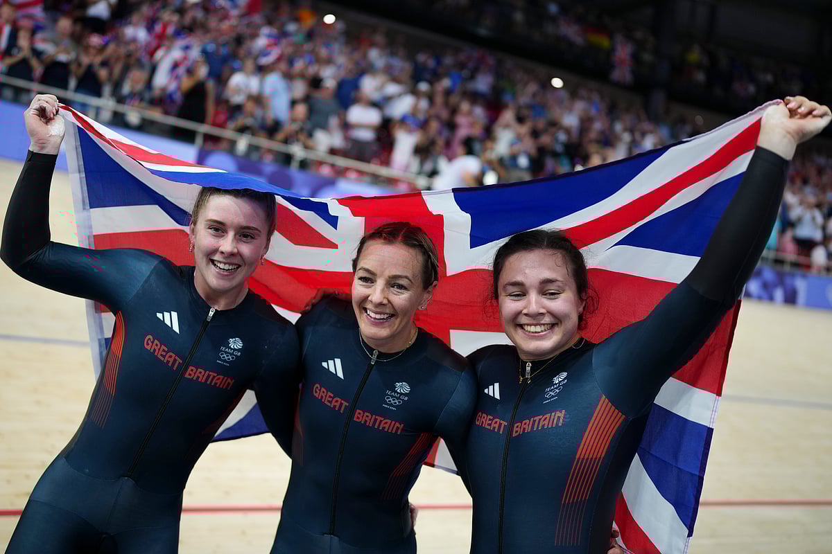 (AP Photo/Thibault Camus) : From left, Sophie Capewell of Team Great Britain, Katy Marchant of Team Great Britain and Emma Finucane of Team Britain celebrate winning the gold medal in the women's team sprint event, at the 2024 Summer Olympics, Monday, Aug. 5, 2024, in Paris, France. 


